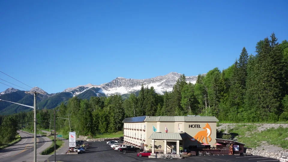 The Fernie Fox Hotel in Fernie, BC, with snow-capped mountains behind